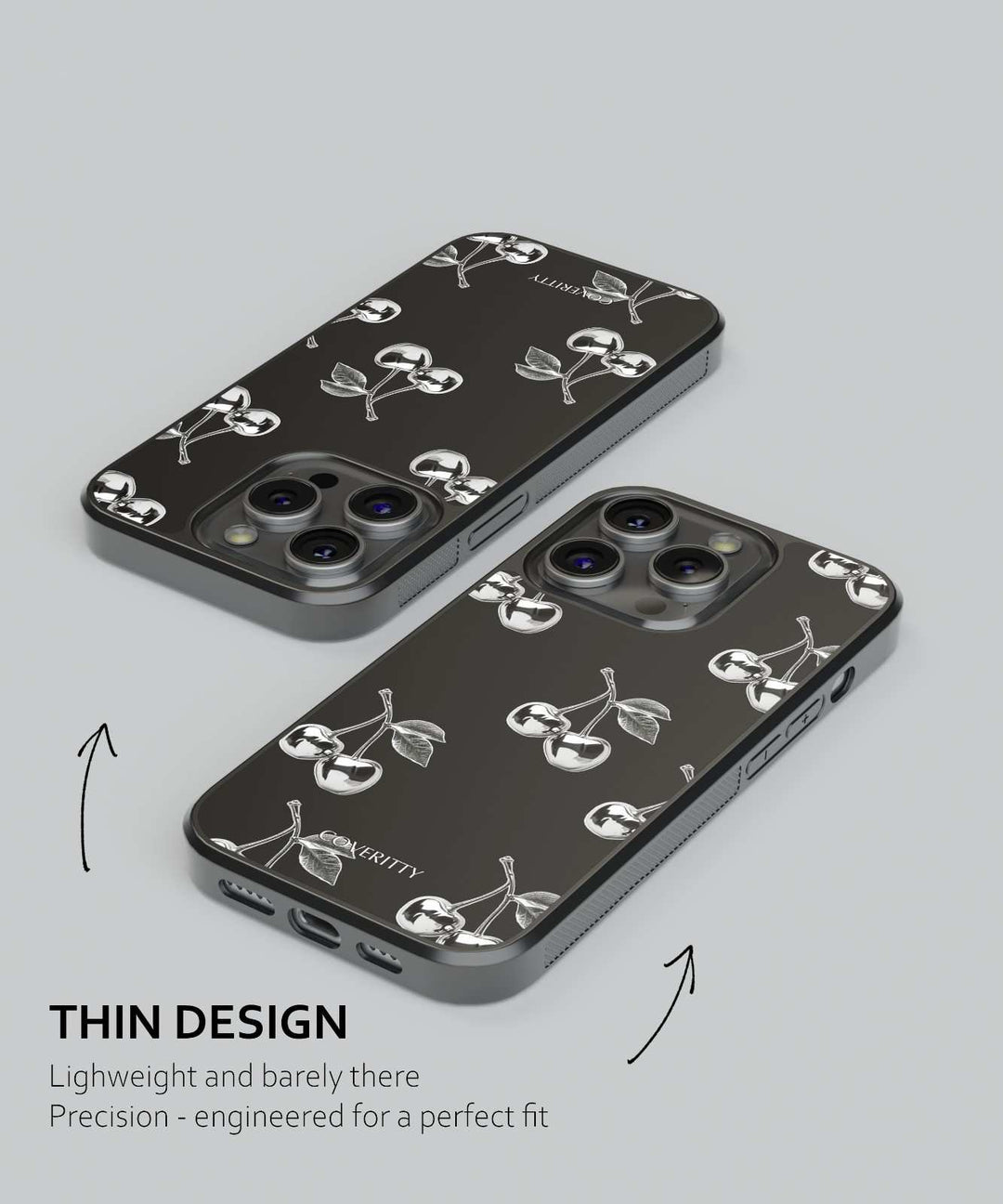 Two black phone cases with white designs on a gray background