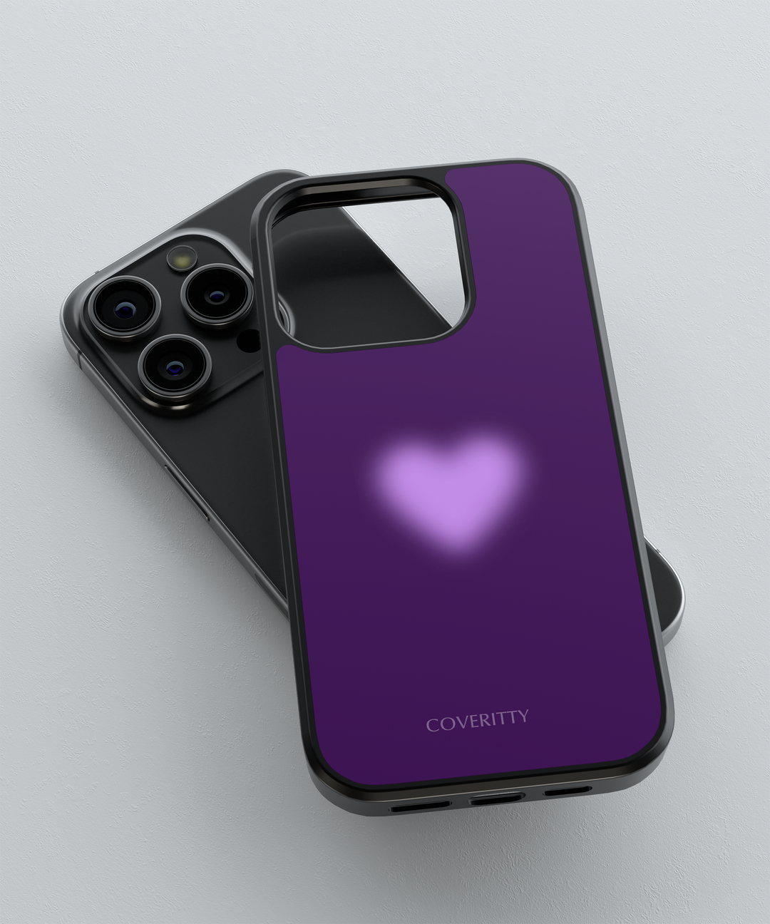 Phone case with purple back and heart design on a light gray background