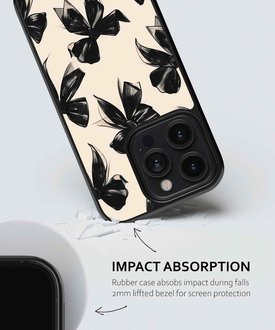Phone case with black floral design on a light background, featuring text about impact absorption.